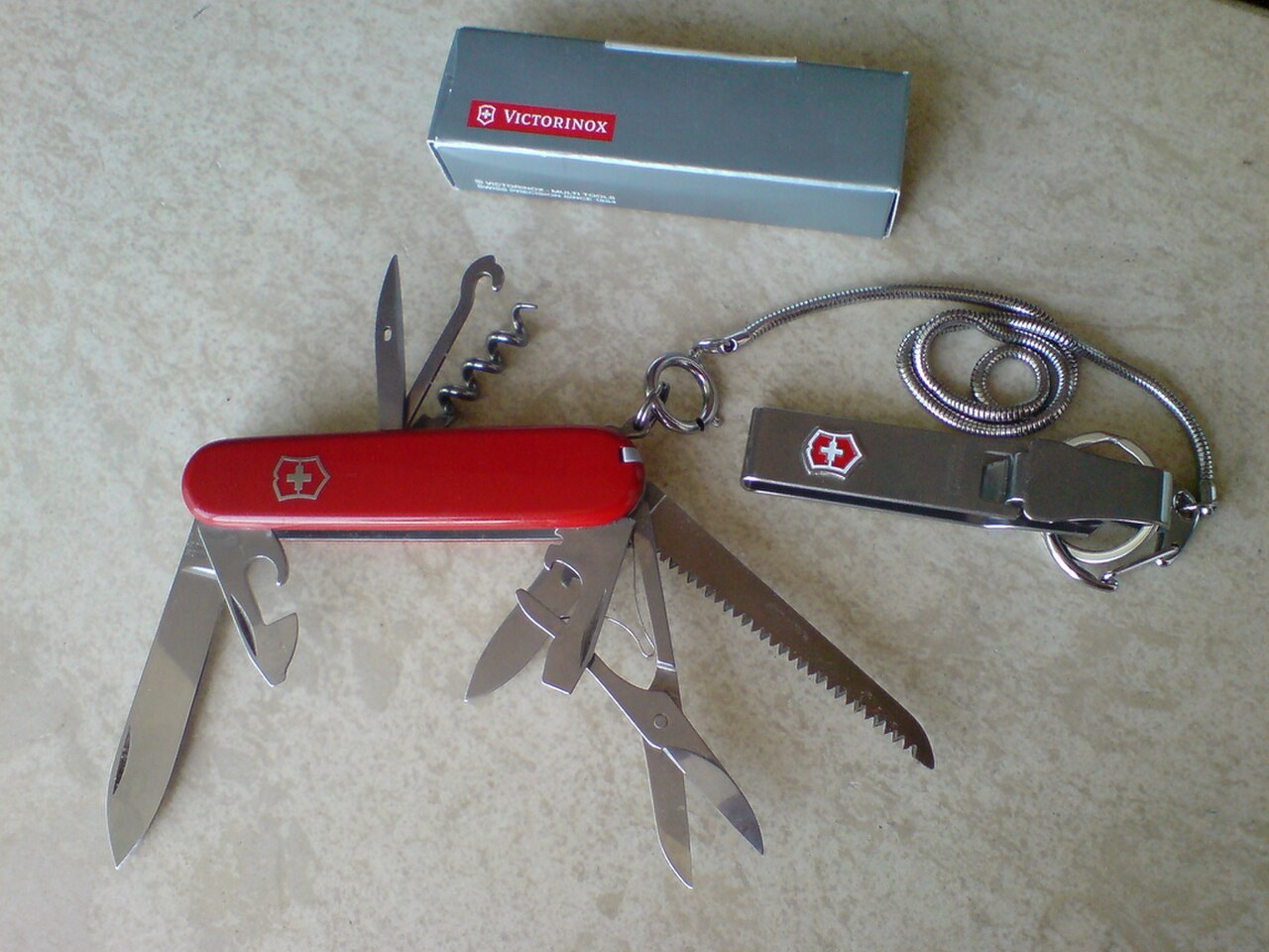 Red Victorinox Huntsman Swiss Army knife with its blades and implements unfolded