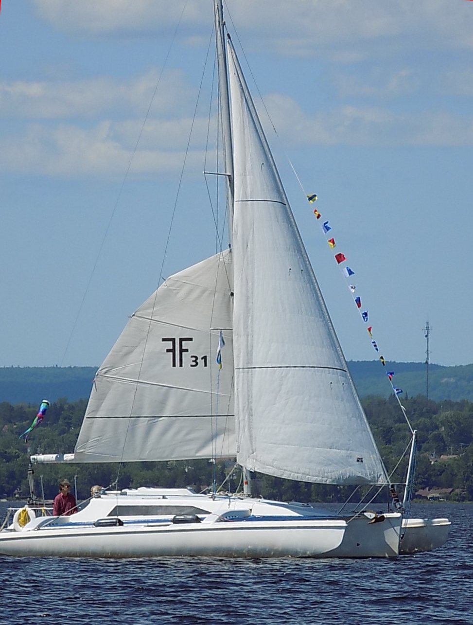 Corsair F-31 folding sailing trimaran on the water